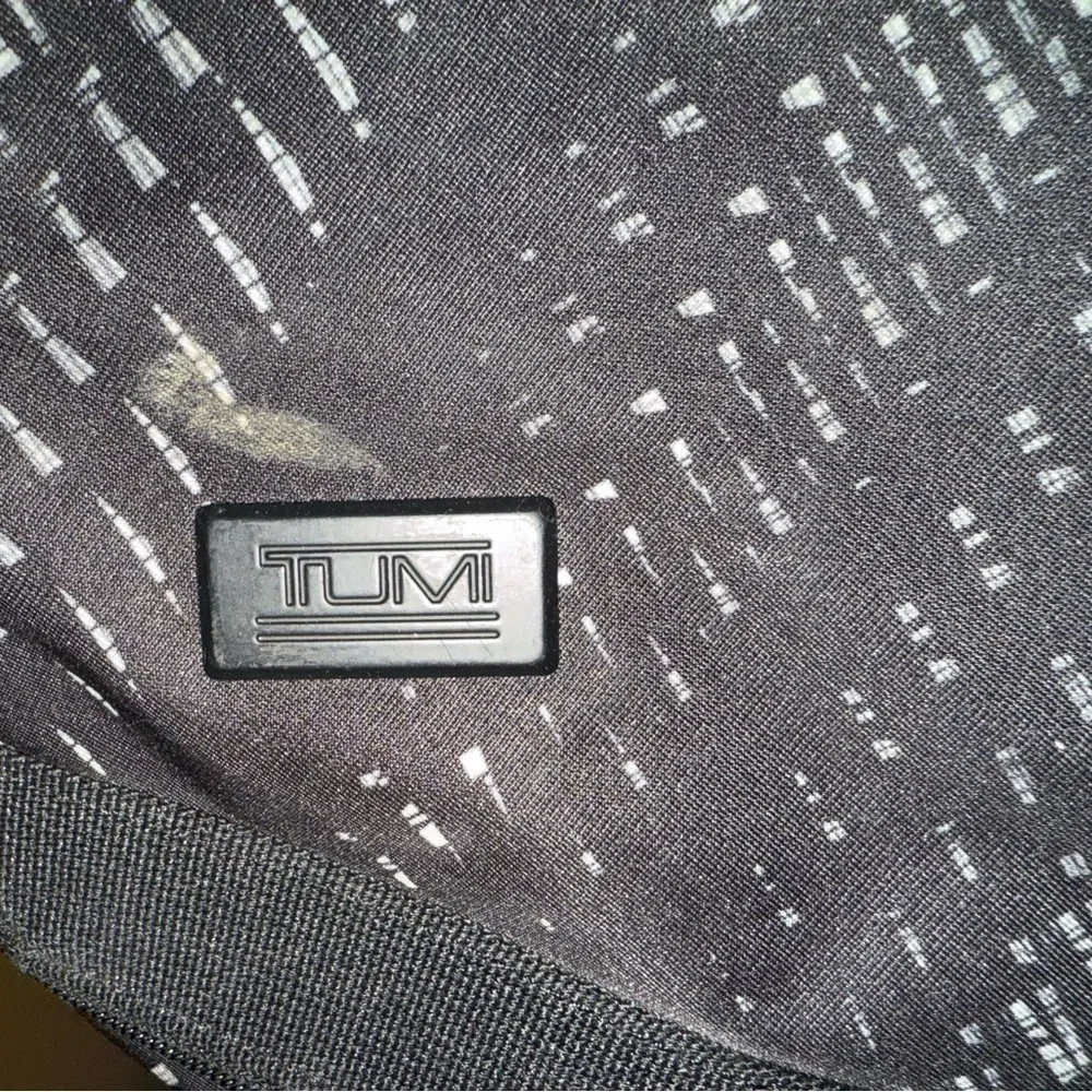 Tumi Black and Gray Patterned Duffel Backpack